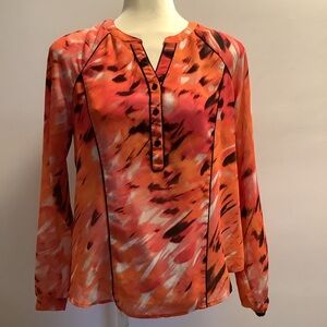 Calvin Klein shades of orange ,black & white.